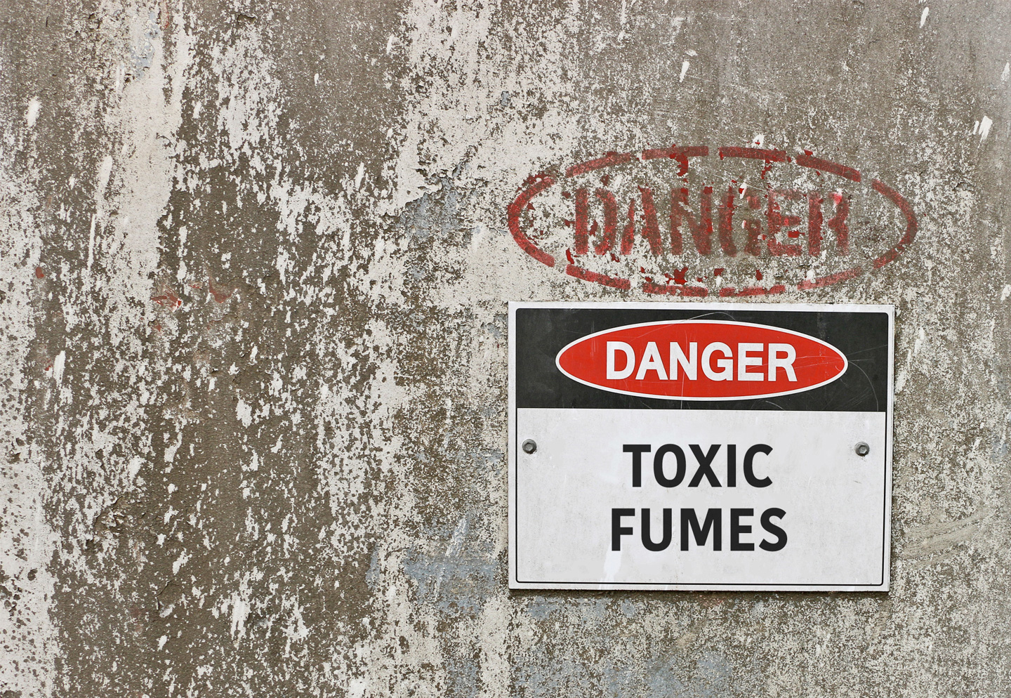 toxic fumes sign posted on wall